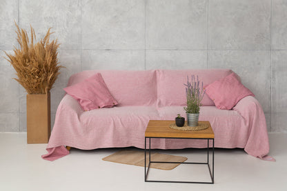 Baby blue linen couch cover by Magenta Sugarplum, showcasing a soft, textured fabric draped over a sofa for home decor.
