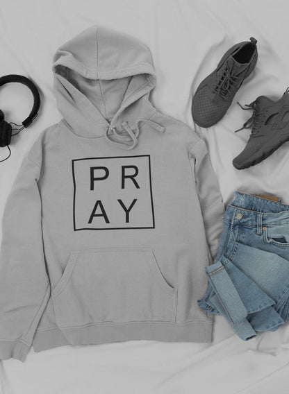 Jade Thalassa Pray hoodie paired with trendy sneakers and jeans, casual streetwear outfit displayed in a mockup image.