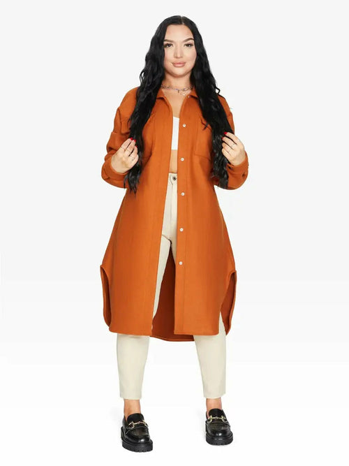 Orange oversized longline shacket by Rose Eleusis, stylish jacket with a relaxed fit, perfect for layering in cool weather.