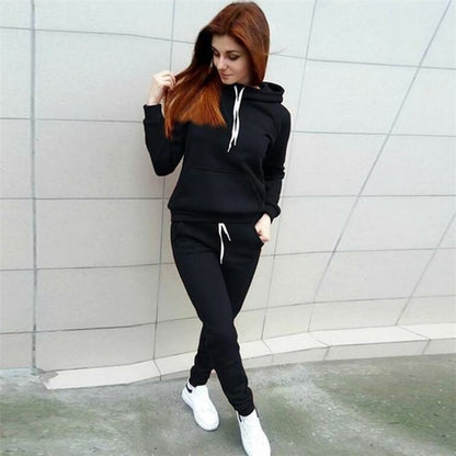 Women’s autumn winter sport suit by Blue Charlie featuring a wine-colored pullover top and matching tracksuit pants.